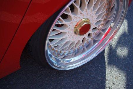 Téléchargez les photos : Low profile chrome wheel on tuner car. Custom polished rims on sports car. - en image libre de droit