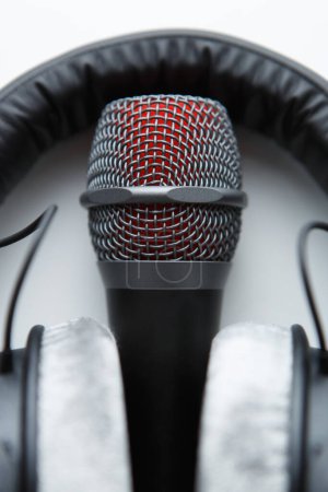 Foto de Vocal microphone and studio headphones in close up. Record voice with professional mic - Imagen libre de derechos