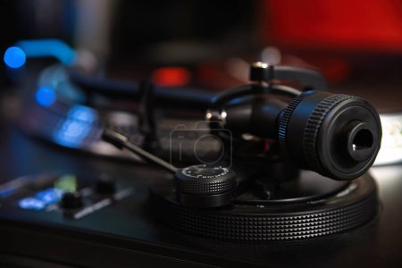 Photo for Turntables tone arm. Dj turn table player device in close up. Hi fi sound system for playing music in high quality - Royalty Free Image