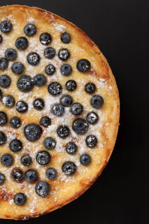 Photo for Home made blueberry pie cooked for dinner and served on black table in flat lay. - Royalty Free Image