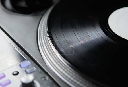 Photo for Vinyl records player for DJ. Professional analog turntable and sound mixer for disc jockey - Royalty Free Image
