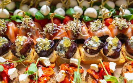 Photo for Tasty little snacks for wine party. Set of gourmet appetizers prepared for food catering service - Royalty Free Image