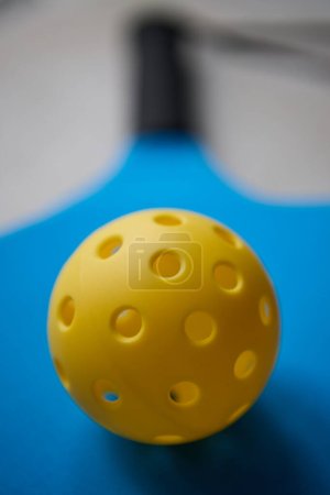 Photo for Pickleball ball on a racket - Royalty Free Image