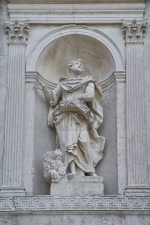Photo for Statue of Saint Jerome (Eusebius Sophronius Hieronymus) on the facade of Church of the Most Holy Redeemer (Italian: Chiesa Del Santissimo Redentore). VENICE - 4 MAY,2019 - Royalty Free Image