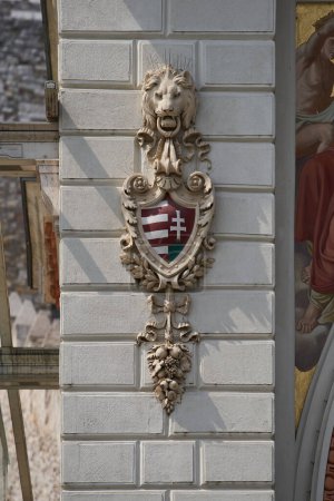 Photo for Coat of arms with lion head and shield on a facade of Varkert Bazar (Hungarian: Vrkert Bazaar or Vrbazr). Budapest, Hungary - 7 May, 2019 - Royalty Free Image
