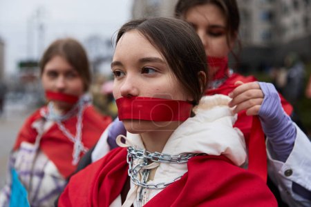 Photo for Young actors preparing for a performance at a public demonstration dedicated to the captured Ukrainian soldiers. Kyiv - 24 March,2024 - Royalty Free Image