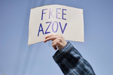Photo for Person holds a sign "Free Azov" on a rally. Kyiv - 31 March,2024 - Royalty Free Image