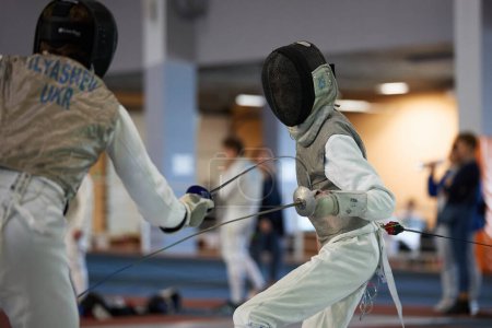 Photo for Professional fencers fighting at the National Fencing Championship of Ukraine. Kyiv - 30 March,2024 - Royalty Free Image