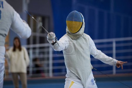 Photo for Portrait of a fencer from the National Olympic Fencing Team Of Ukraine at the National Fencing Championship of Ukraine. Kyiv - 30 March,2024 - Royalty Free Image