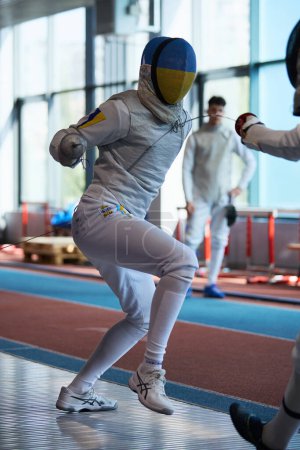 Photo for National Fencing Olympic Team member fighting at the Championship of Ukraine. Kyiv - 30 March,2024 - Royalty Free Image