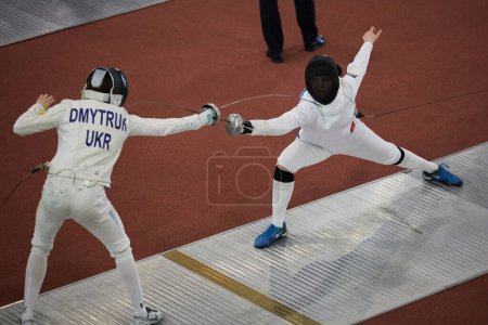 Photo for Male fencer attacks with epee blade during the National Fencing Championship of Ukraine. Kyiv - 30 March,2024 - Royalty Free Image