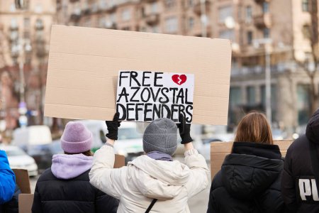 Photo for Activist holds a banner "Free Azovstal Defenders" on a peaceful rally in Kyiv - 4 February,2024 - Royalty Free Image