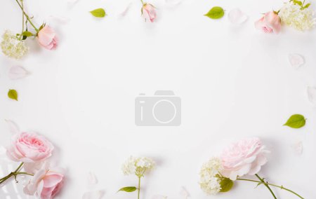 Photo for Festive flower composition on white background. Overhead view - Royalty Free Image