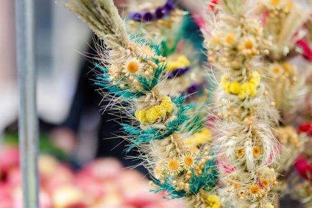 Foto de Traditional Lithuanian Easter palms known as verbos sold on Kaziukas, Easter market in Vilnius. Lithuanian capitals annual traditional crafts fair is held every March on Old Town streets. - Imagen libre de derechos