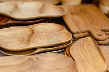 Foto de Wooden kitchenware and decorations sold on Easter market in Vilnius. Lithuanian capitals annual traditional crafts fair is held every March on Old Town streets - Imagen libre de derechos