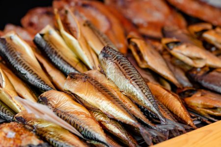 Selection of assorted home made smoked fish on a farmers market in Vilnius, Lithuania. Kaziukas, traditional spring fair in capital of Lithuania.