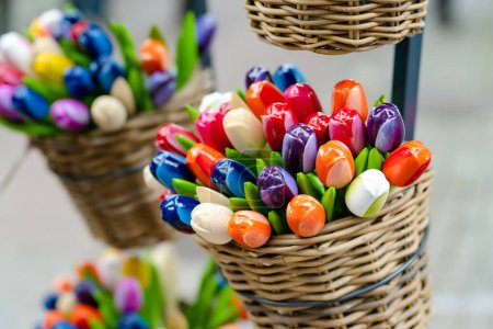 Foto de Colourful wooden tulips sold on Easter market in Vilnius. Annual spring fair hold in March on the streets of capital of Lithuania. - Imagen libre de derechos