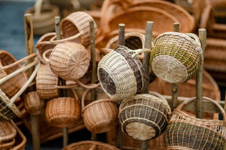 Foto de Wicker baskets of various sizes sold on Easter market in Vilnius. Annual spring fair hold in March on the streets of capital of Lithuania. - Imagen libre de derechos