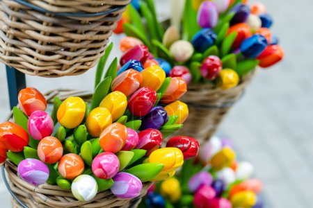 Foto de Colourful wooden tulips sold on Easter market in Vilnius. Annual spring fair hold in March on the streets of capital of Lithuania. - Imagen libre de derechos