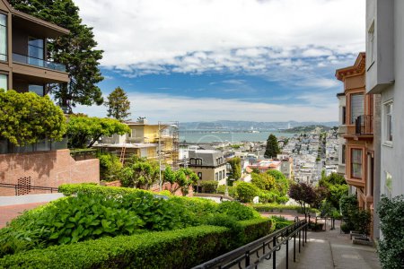 Photo for SAN FRANCISCO, USA - APRIL 2016: Famous Lombard street, one of the most famous landmark and the crookedest street in the world. San Francisco, California, USA - Royalty Free Image