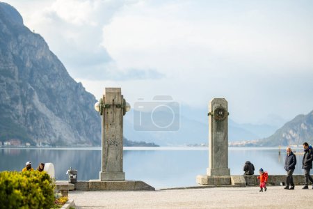 Photo for LECCO, ITALY - APRIL 2022: Tourists and locals spending sunny spring day in Lecco, a town on the shore of Lake Como. Charming location with typical Italian atmosphere. Lecco, Lombardy, Italy. - Royalty Free Image