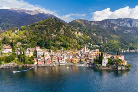Photo for Beautiful aerial waterfront cityscape of Varenna, one of the most picturesque towns on the shore of Lake Como. Charming location with typical Italian atmosphere. Varenna, Lombardy, Italy. - Royalty Free Image