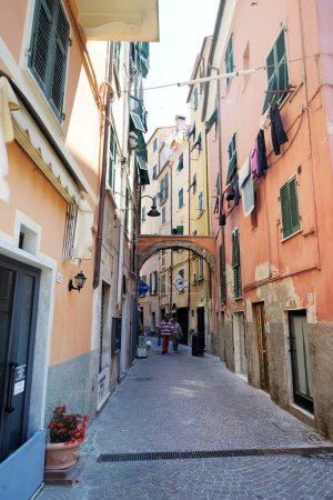 Photo for SAN TERENZO, ITALY - MAY 2011: Narrow medieval streets of picturesque San Terenzo village. Gulf of La Spezia, Liguria, Italy, Europe - Royalty Free Image
