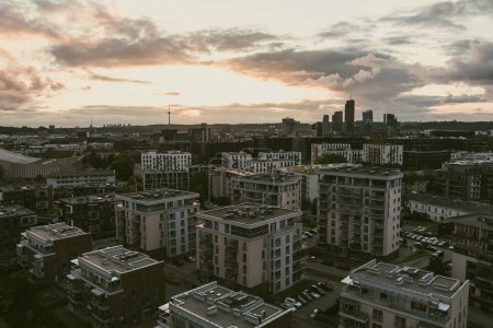 Photo for Beautiful aerial evening view of Vilnius business district with scenic sunset illumination. City life in Vilnius city, Lithuania. - Royalty Free Image