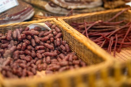Photo for Selection of assorted home made meats, jerky and sausages on a farmers market in Vilnius, Lithuania. Kaziukas, traditional spring fair in capital of Lithuania. - Royalty Free Image