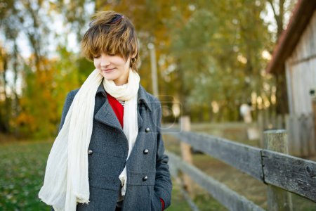 Photo for Adorable young girl having fun on beautiful autumn day. Happy teenager portrait in autumn park. Autumn activities for children. - Royalty Free Image