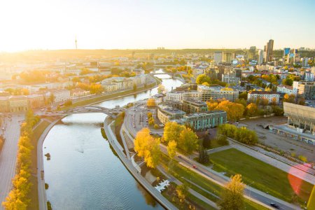 Beautiful Vilnius city panorama in autumn with orange and yellow foliage. Aerial evening view. Fall city scenery in Vilnius, Lithuania