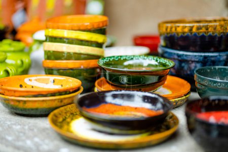 Photo for Ceramic dishes, tableware and jugs sold on Easter market in Vilnius. Lithuanian capital's annual traditional crafts fair is held every March on Old Town streets. - Royalty Free Image