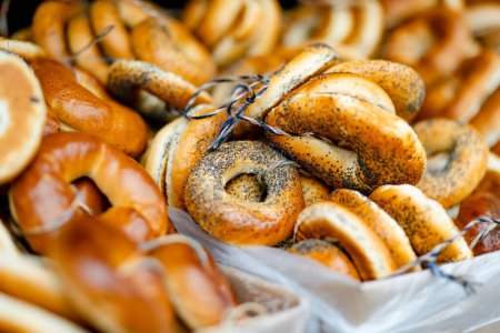 Photo for Loaves of organic bagels for sale at outdoor farmers market in Vilnius. Traditional spring fair in Vilnius, the capital of Lithuania. - Royalty Free Image