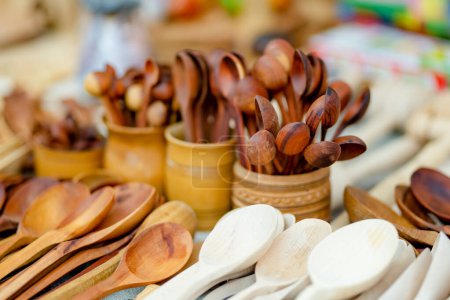 Photo for Wooden kitchenware and decorations sold on Easter market in Vilnius. Lithuanian capital's annual traditional crafts fair is held every March on Old Town streets - Royalty Free Image