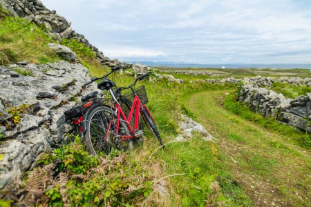 Bikes parked on Inishmore, the largest of the Aran Islands in Galway Bay, Ireland. Renting a bicycle is one of the most popular way to get around Inis Mor.
