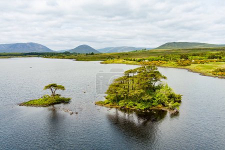 Photo for Beautiful view of Lough Bofin lake in Connemara region in Ireland. Scenic Irish countryside landscape with magnificent mountains on the horizon, county Galway, Ireland. - Royalty Free Image