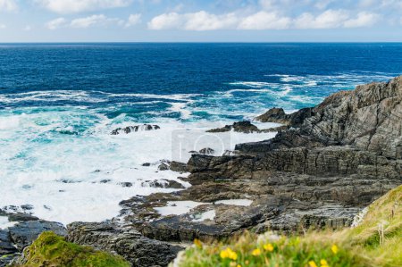Rough and rocky shore at Malin Head, Ireland's northernmost point, Wild Atlantic Way, spectacular coastal route. Wonders of nature. Numerous Discovery Points. Co. Donegal
