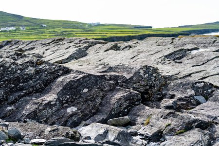 Rough and rocky shore along famous Ring of Kerry route. Rugged coast of on Iveragh Peninsula, County Kerry, Ireland.