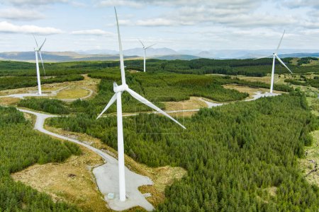 Photo for Connemara aerial landscape with wind turbines of Galway Wind Park located in Cloosh Valley, County Galway. Largest onshore wind farm in Ireland, green energy generation. Galway Wind Way recreation. - Royalty Free Image