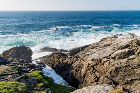 Photo for Rough and rocky shore at Malin Head, Ireland's northernmost point, Wild Atlantic Way, spectacular coastal route. Wonders of nature. Numerous Discovery Points. Co. Donegal - Royalty Free Image