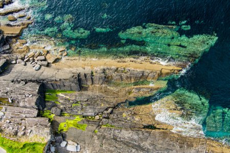 Aerial view of rough and rocky shore along famous Ring of Kerry route. Rugged coast of on Iveragh Peninsula, County Kerry, Ireland.