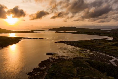 Photo for Aerial sunset view of Derreen river along the Ring of Kerry route. Rugged coast of on Iveragh Peninsula on sunset, County Kerry, Ireland. - Royalty Free Image