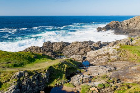 Rough and rocky shore at Malin Head, Ireland's northernmost point, Wild Atlantic Way, spectacular coastal route. Wonders of nature. Numerous Discovery Points. Co. Donegal