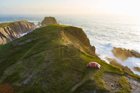 Camping tent on the cliff at Scheildren, most iconic and photographed landscape at Malin Head, Wild Atlantic Way, spectacular coastal route. Wonders of nature. Numerous Discovery Points. Co. Donegal