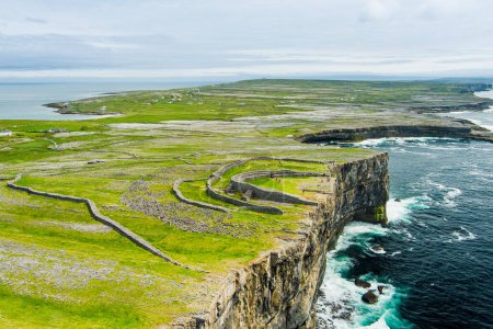 Aerial view of Dun Aonghasa or Dun Aengus , the largest prehistoric stone fort of the Aran Islands, popular tourist attraction, important archaeological site, Inishmore island, Ireland