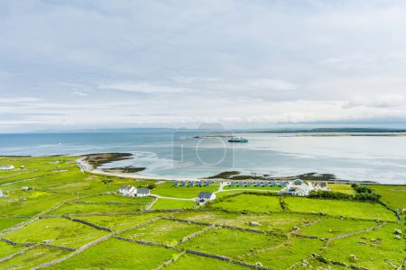 Photo for Aerial view of Inishmore or Inis Mor, the largest of the Aran Islands in Galway Bay, Ireland. Famous for its strong Irish culture, loyalty to the Irish language, and a wealth of ancient sites. - Royalty Free Image