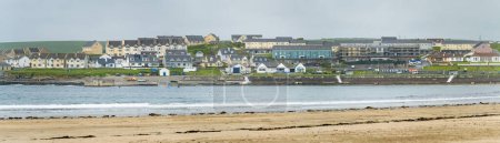 Photo for Kilkee, small coastal town, popular as a seaside resort, located in horseshoe bay and protected from the Atlantic Ocean by the Duggerna Reef, county Clare, Ireland. - Royalty Free Image