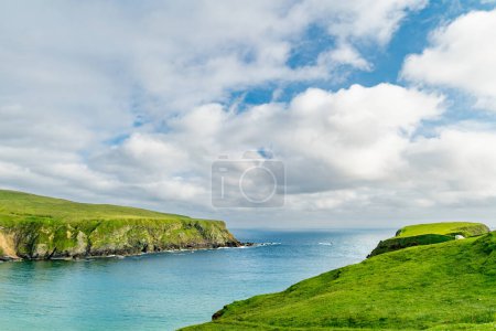 Photo for Silver Strand, a sandy beach in a sheltered, horseshoe-shaped bay, situated at Malin Beg, near Glencolmcille, in south-west County Donegal. Wild Atlantic Way, spectacular coastal route in Ireland. - Royalty Free Image
