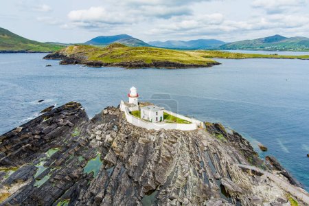 Beautiful aerial view of Valentia Island Lighthouse at Cromwell Point. Locations worth visiting on the Wild Atlantic Way. Scenic Irish countyside on sunny summer day, County Kerry, Ireland.