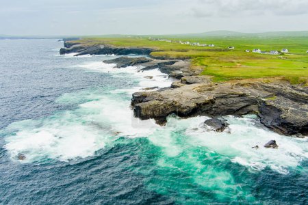 Photo for Aerial view of spectacular Kilkee Cliffs, situated at the Loop Head Peninsula, remote and wild stretch of stunning coastline, Wild Atlantic Way Discovery Point, county Clare, Ireland. - Royalty Free Image